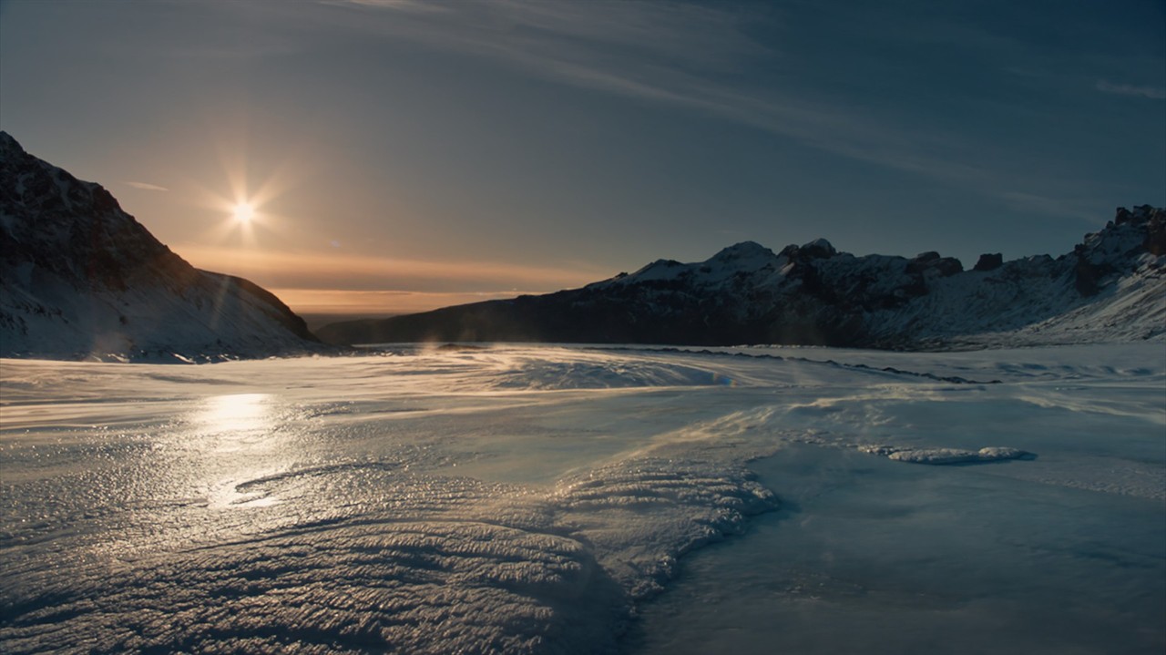 Glacier surrounded by mountains